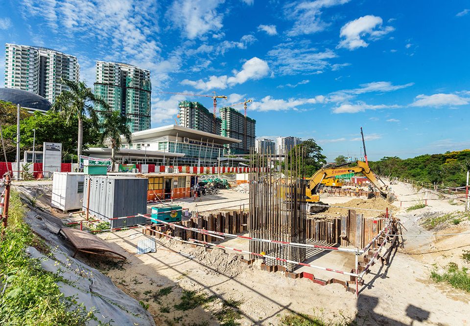 View of MRT construction works in front of the Muhibbah Showroom at Prima Damansara with bored piling and pile cap construction in progress.
