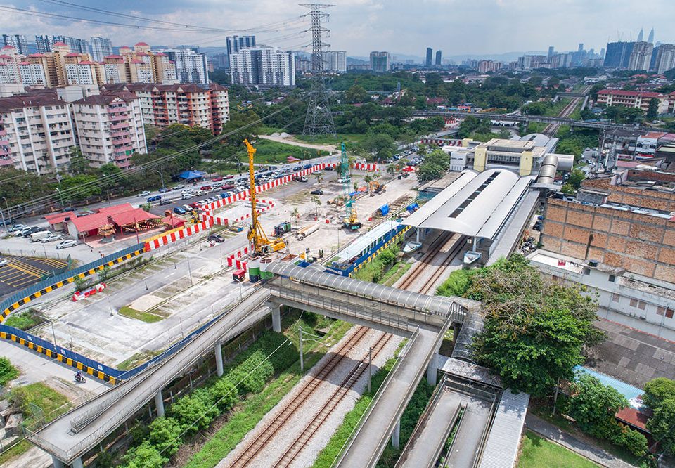 View of construction work for the future Kampung Batu MRT Station in the Kampung Batu KTM Station car park, with the completed replacement carparks behind.