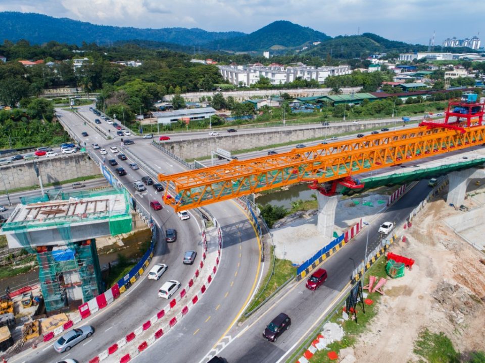 Erection of segmental box girder for long span crossing No 1, near the ramp to Sungai Buloh Toll Plaza.