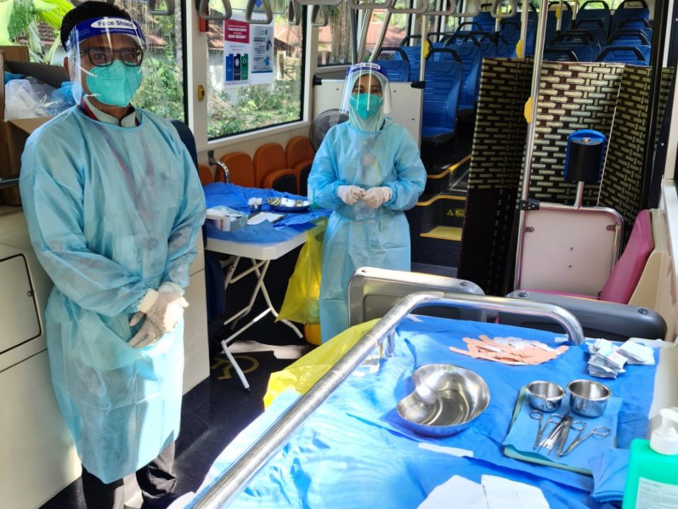 READY: The medical personnel from University of Malaya Medical Centre ready to provide Covid-19 vaccinations inside the MRT Feeder Bus